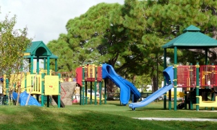 Playground with slides, towers and climbing apparatus